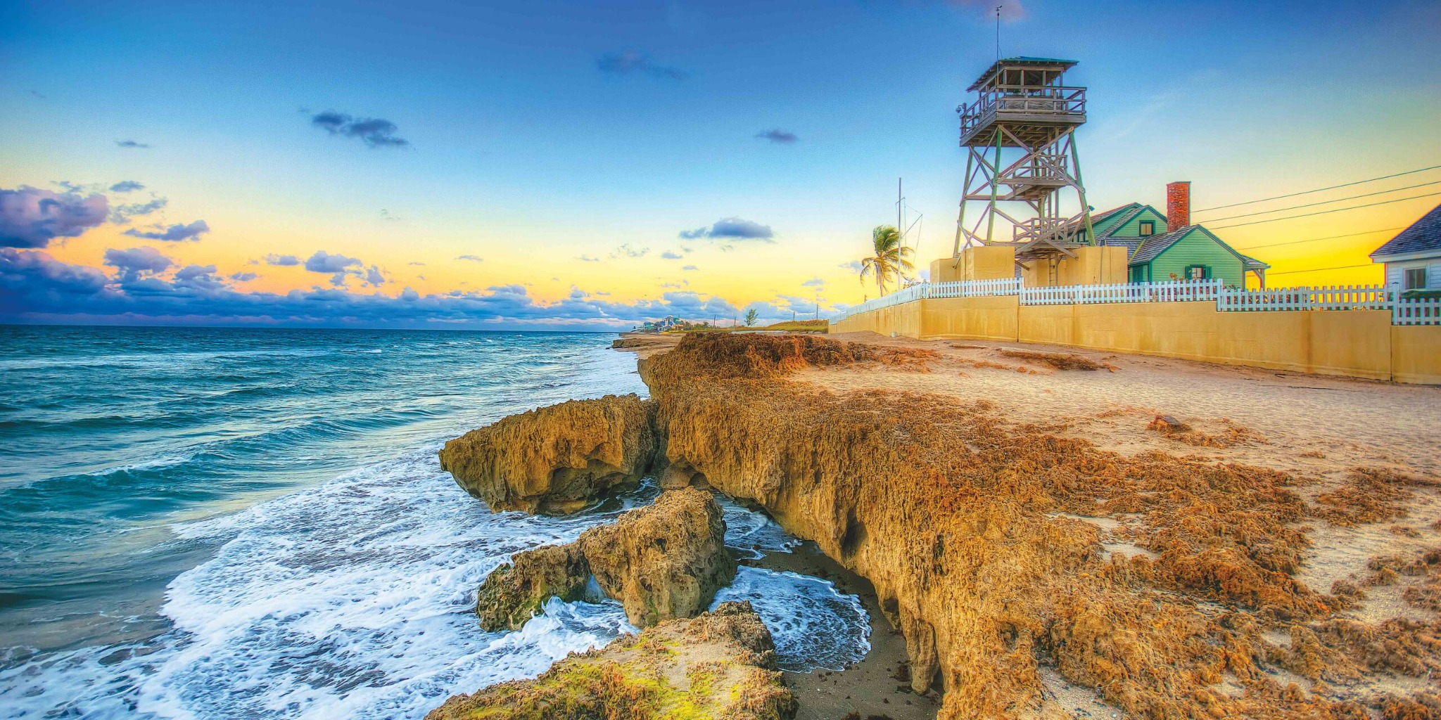 Rocky shoreline and historic House of Refuge on Hutchinson Island, Florida