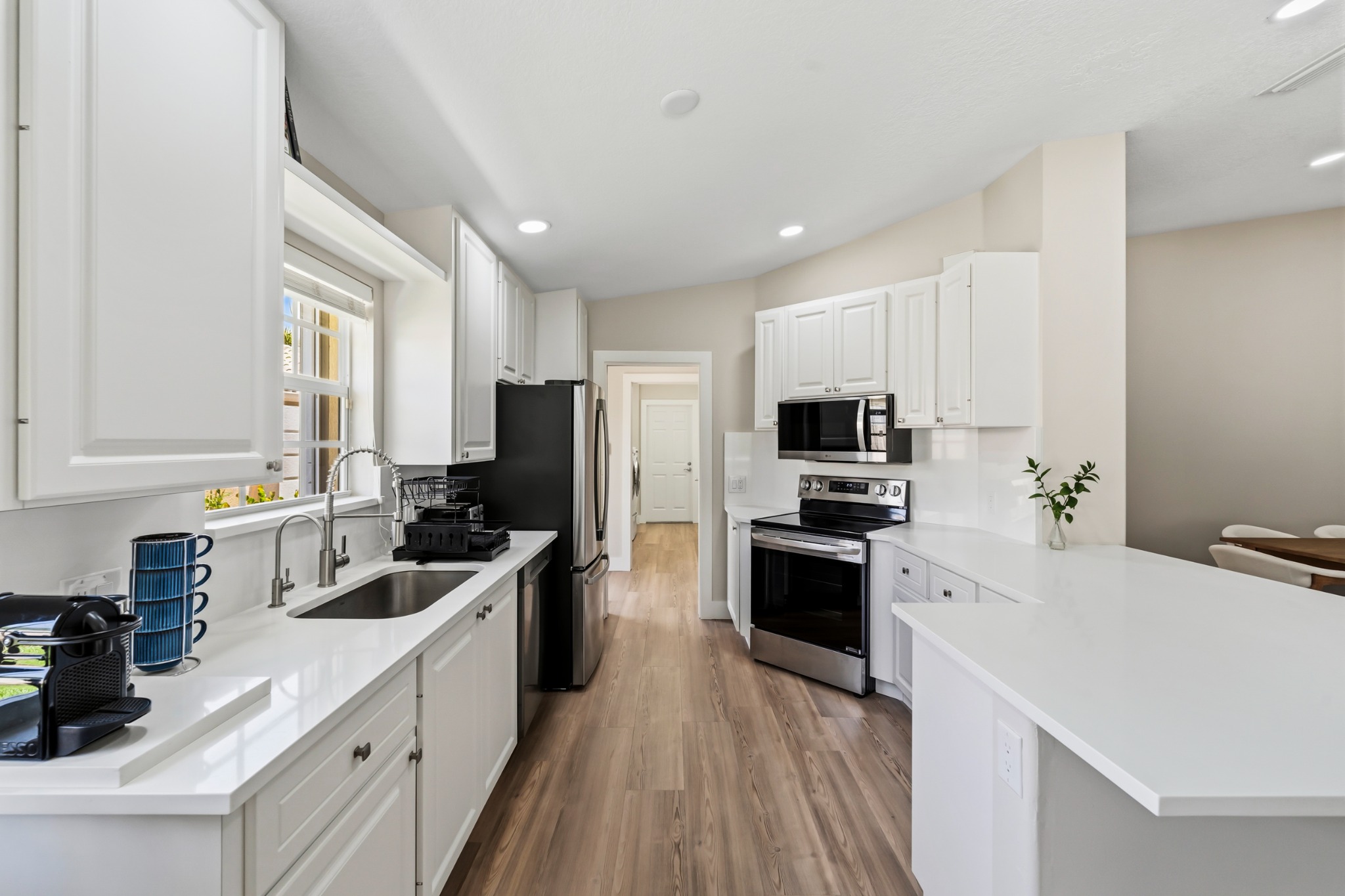 Updated bright white kitchen at 8437 SE Retreat Drive