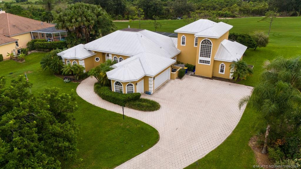 Aerial view of 10567 SW Whooping Crane Drive in Palm City, Florida